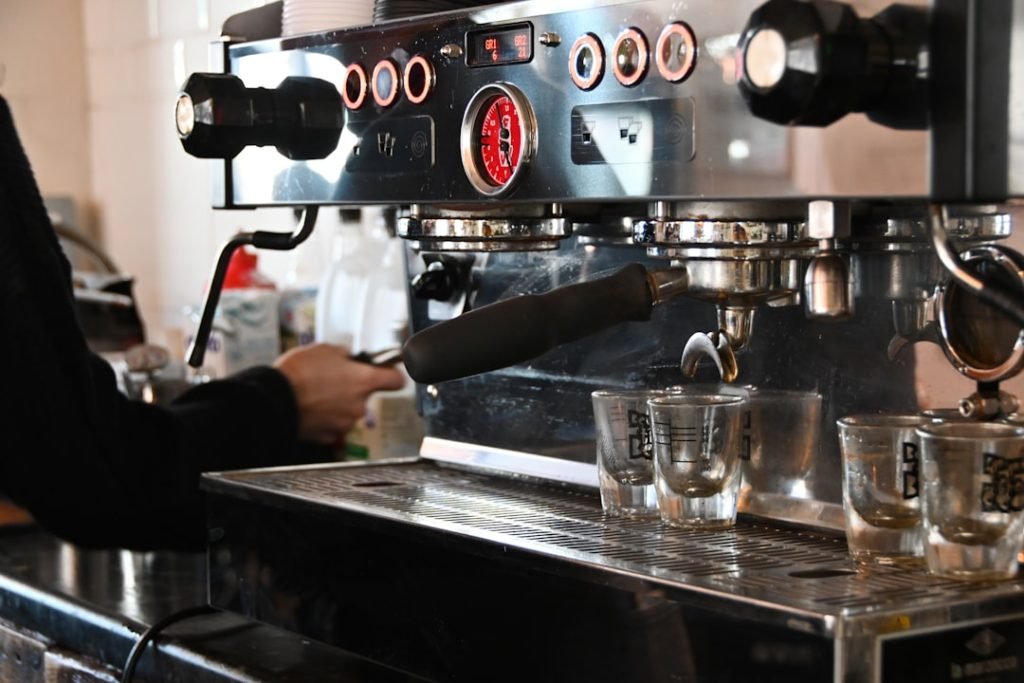 a-person-pouring-a-drink-into-a-glass-ppydivn-kaw